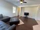 Spacious living room with hardwood floors, neutral walls, and plenty of natural light at 11420 Bridge Pine Dr, Riverview, FL 33569