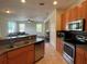 View from the kitchen shows an open floor plan with access to the living room at 11420 Bridge Pine Dr, Riverview, FL 33569