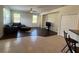 Open floor plan showing the living room and eat-in kitchen separated by tile and wood flooring at 11420 Bridge Pine Dr, Riverview, FL 33569