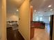 This living space features an open floor plan with views from the kitchen to the living room at 11420 Bridge Pine Dr, Riverview, FL 33569
