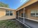 Relaxing screened-in patio perfect for outdoor dining and entertaining with sliding glass door access to the home at 11420 Bridge Pine Dr, Riverview, FL 33569