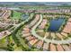 Aerial view displays a lovely, lakeside community, golf course, and beautiful homes with pools at 12672 Fontana Loop, Bradenton, FL 34211