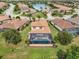 Aerial view of home showing large screened lanai with beautiful private pool overlooking a lake at 12672 Fontana Loop, Bradenton, FL 34211