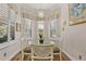 Cozy breakfast nook with ample natural light and elegant window treatments at 12672 Fontana Loop, Bradenton, FL 34211