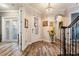 Welcoming foyer with tile flooring, a chandelier, and a staircase showcasing the home's elegant interior at 12672 Fontana Loop, Bradenton, FL 34211