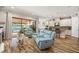 Bright living space features an open layout with access to the pool area and a modern kitchen at 12672 Fontana Loop, Bradenton, FL 34211