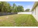 Large fenced backyard and lawn area, perfect for entertaining at 12746 Standbridge Dr, Riverview, FL 33579