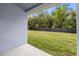 Back patio overlooking fenced backyard and mature trees at 12746 Standbridge Dr, Riverview, FL 33579