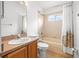 Bathroom with tiled shower-tub combo and wood vanity at 12746 Standbridge Dr, Riverview, FL 33579