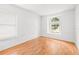 Bright bedroom with wood floors and large window at 12746 Standbridge Dr, Riverview, FL 33579