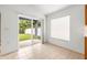 Living area with tile flooring and sliding door to outdoor patio at 12746 Standbridge Dr, Riverview, FL 33579
