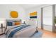 Comfortable main bedroom with hardwood floors, neutral decor, and ample natural light at 12746 Standbridge Dr, Riverview, FL 33579