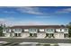 Modern townhome exterior showcases covered entries, garages, and neutral color palette at 13244 Stable Pl, Parrish, FL 34219