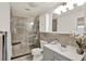 Bathroom featuring glass enclosed shower, vanity, and decorative finishes at 13926 Darlene Ave, Hudson, FL 34667