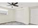 Bedroom with ceiling fan, tiled floors, and window with white blinds at 13926 Darlene Ave, Hudson, FL 34667