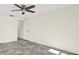 Bedroom featuring tile flooring, a ceiling fan, and neutral paint at 13926 Darlene Ave, Hudson, FL 34667