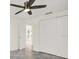 Bedroom featuring a ceiling fan, neutral paint, and closet at 13926 Darlene Ave, Hudson, FL 34667