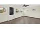 Cozy room with multiple windows, tile floor, and exterior door at 13926 Darlene Ave, Hudson, FL 34667