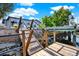 Waterfront property featuring a wooden dock, railings, and a tranquil waterway at 13926 Darlene Ave, Hudson, FL 34667