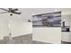 Bright open concept living space with decorative nautical themed art on the wall at 13926 Darlene Ave, Hudson, FL 34667