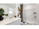 Modern bathroom with sleek vanity, shower-tub combination, and stylish decorative accents at 14036 Textile Run, Parrish, FL 34219