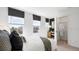 Bedroom with large windows, ample natural light, and a walk-in closet for storage at 14036 Textile Run, Parrish, FL 34219