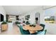 Open living space with dining area, contemporary furnishings, and inviting atmosphere for relaxation at 14036 Textile Run, Parrish, FL 34219