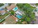 Aerial view of neighborhood with mature tree coverage, pools and fenced in yards at 14321 113Th Ave, Largo, FL 33774