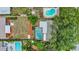 Aerial view of property showing in-ground pool, fenced yard and mature trees at 14321 113Th Ave, Largo, FL 33774