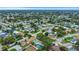 Expansive aerial shot of a lush, green neighborhood showcasing numerous homes and tree coverage at 14321 113Th Ave, Largo, FL 33774