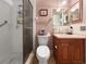 Bathroom showcasing a glass-enclosed shower, toilet, and vanity with sink at 14321 113Th Ave, Largo, FL 33774