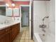 Bathroom showcasing a shower/tub combo, vanity with sink and pink walls at 14321 113Th Ave, Largo, FL 33774