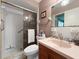 Bathroom with walk-in shower, peach walls, toilet, and vanity with sink at 14321 113Th Ave, Largo, FL 33774
