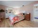 Comfortable bedroom with light pink walls and wooden floors at 14321 113Th Ave, Largo, FL 33774