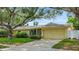 Charming single story home with mature trees, landscaped yard and two car garage at 14321 113Th Ave, Largo, FL 33774