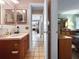 Hallway view showing access to the bathroom and kitchen at 14321 113Th Ave, Largo, FL 33774