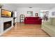 Open living room featuring hardwood floors and access to the dining area at 14321 113Th Ave, Largo, FL 33774