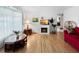 Comfortable living room featuring a decorative fireplace and hardwood flooring at 14321 113Th Ave, Largo, FL 33774