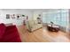 Bright living room featuring hardwood floors and abundant natural light at 14321 113Th Ave, Largo, FL 33774