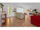 Cozy living room with fireplace, hardwood floors, and large window at 14321 113Th Ave, Largo, FL 33774