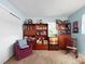 Cozy living room features vintage furnishings, shelving, and comfortable seating at 14321 113Th Ave, Largo, FL 33774