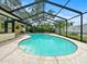 Backyard view of enclosed swimming pool with patio and attached to the home at 14321 113Th Ave, Largo, FL 33774