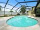 Backyard view of enclosed swimming pool with patio and attached to the home at 14321 113Th Ave, Largo, FL 33774