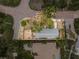 An aerial view of the property showcasing the roof and surrounding greenery, plus the shape of the lot at 1470 Serpentine S Dr, St Petersburg, FL 33705