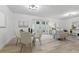 Inviting dining room offers a cozy setting with contemporary decor, adjacent to the open living area at 1470 Serpentine S Dr, St Petersburg, FL 33705