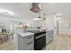 Modern kitchen featuring stainless steel appliances, quartz countertops, and white cabinets at 1470 Serpentine S Dr, St Petersburg, FL 33705