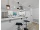 Modern kitchen featuring stainless steel appliances, quartz countertops, and white cabinets at 1470 Serpentine S Dr, St Petersburg, FL 33705