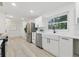 Modern kitchen featuring stainless steel appliances, quartz countertops, and white cabinets at 1470 Serpentine S Dr, St Petersburg, FL 33705