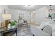 Bright living room featuring neutral paint, a modern ceiling fixture and hardwood flooring at 1470 Serpentine S Dr, St Petersburg, FL 33705