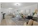 Inviting living room featuring hardwood floors and an open concept layout at 1470 Serpentine S Dr, St Petersburg, FL 33705